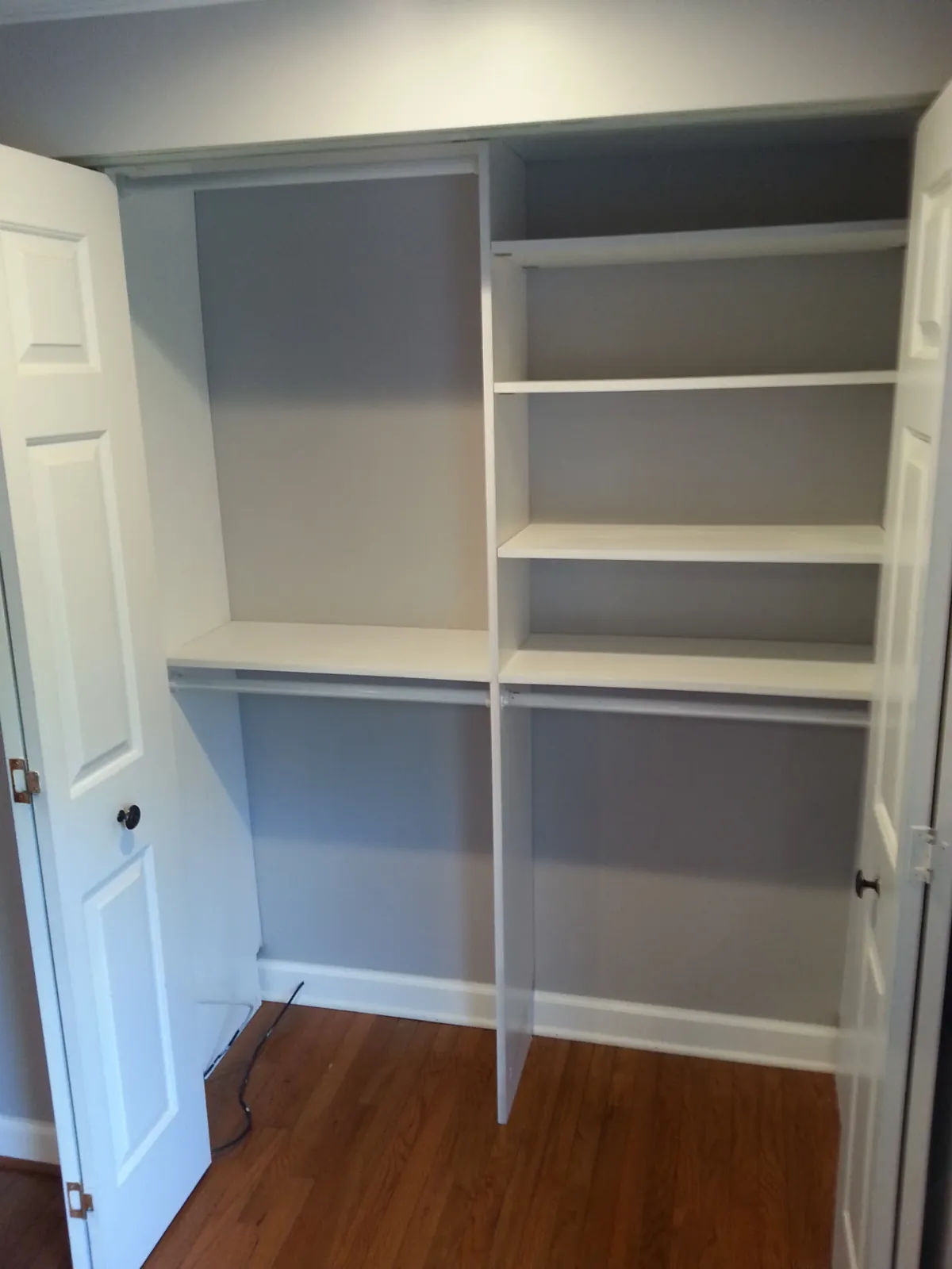 Custom built-in closet shelving with white finish